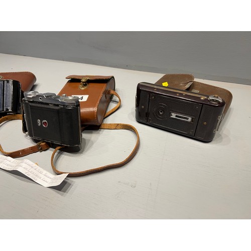 44 - 3 Vintage cameras in cases