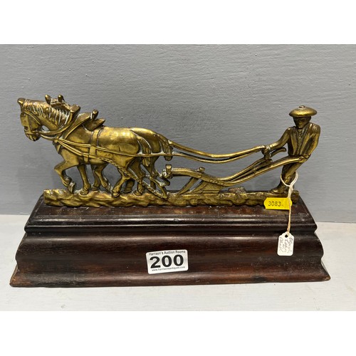 200 - Early 20th century brass ploughing figure on base