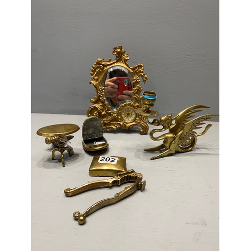 202 - Good brass ware inc dragon candle holder & clock mirror