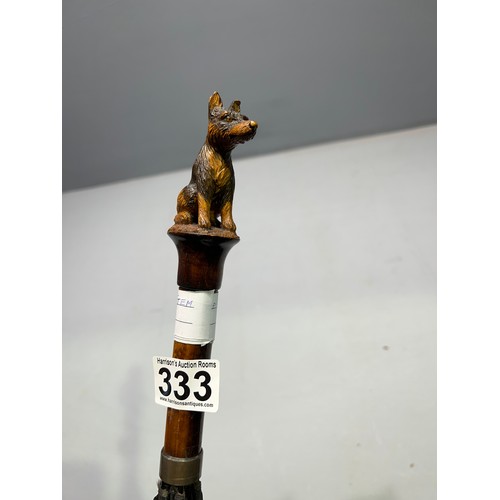 333 - 20th century brolley with cover having carved dog on the end of handle