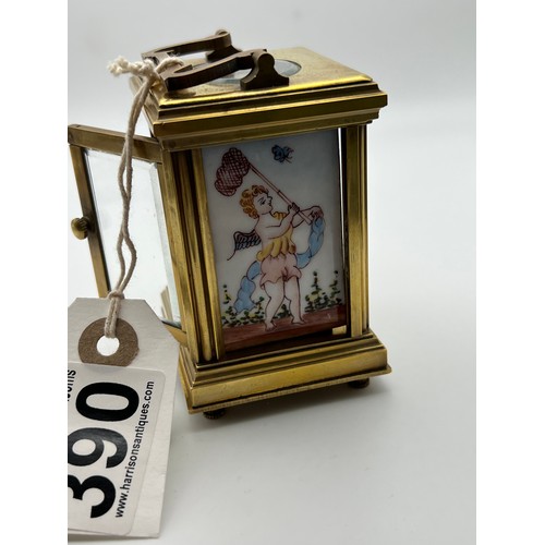 390 - Small brass carriage clock & key with picture enamel design on front & sides working