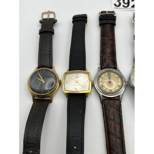 392 - 7 Leather strap gents watches