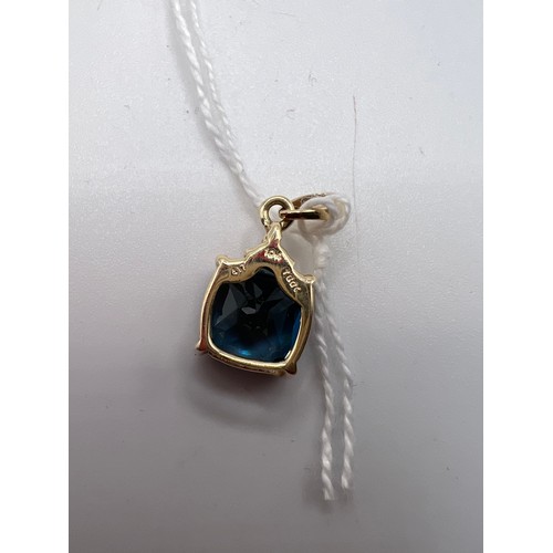 455 - 10ct Gold pendant with blue & white stones gross 2.5g