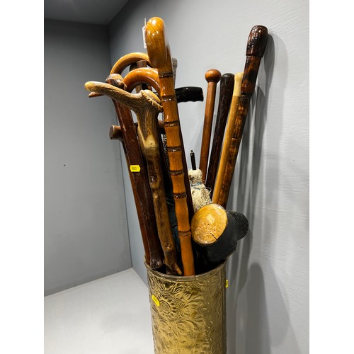 534 - Quantity of walking sticks in brass base