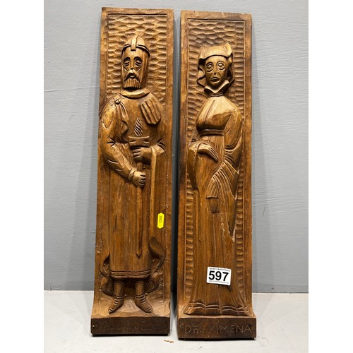 597 - Pair of carved figure wall plaques