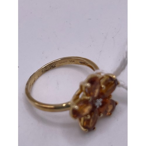 461 - 9ct Gold dress ring with amber coloured stones size L gross 2.6g