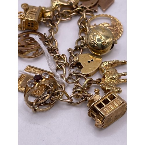 465 - 9ct Gold charm bracelet wit heart lock gross 41.1g