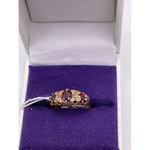 465c - 18ct Gold diamond & ruby ring size m gross 2.4g