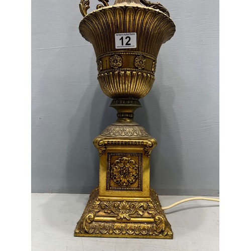 12 - Early 20th century quality brass table lamp of larger size heavily decorated