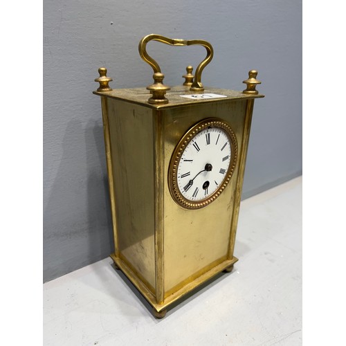 61 - Early 1900's brass clock (missing glass)