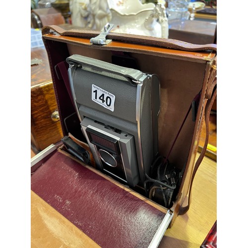 140 - Vintage polaroid camera in leather case