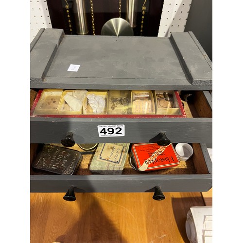 492 - Miniature Collectors chest full of watch pads & some interesting Tins