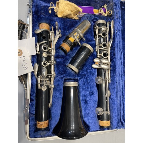 135a - Boosey & Hawkes cased clarinet with music