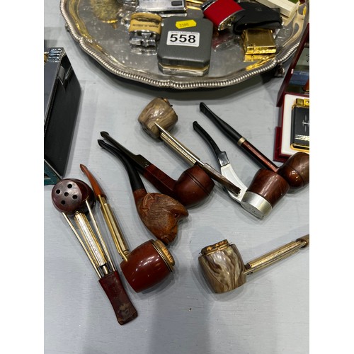 558 - Tray of collectable lighters & pipe (2 lighters are musical)