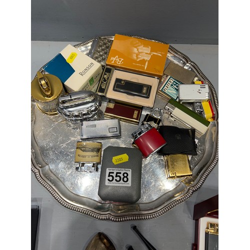 558 - Tray of collectable lighters & pipe (2 lighters are musical)