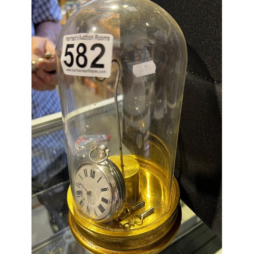 582 - Silver pocket watch on stand (under glass dome)