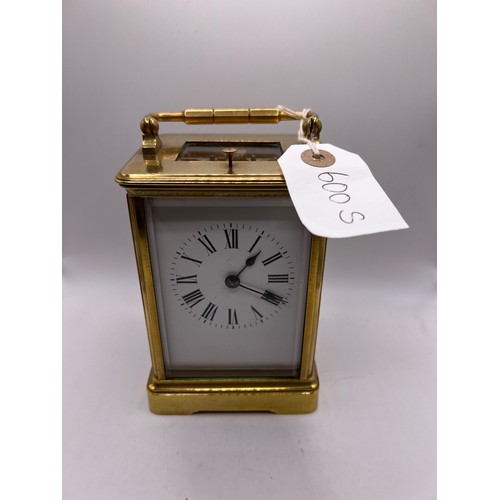 600s - brass carriage clock with striking bell ticking away