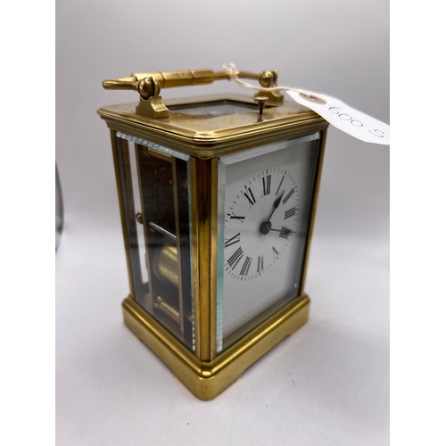 600s - brass carriage clock with striking bell ticking away