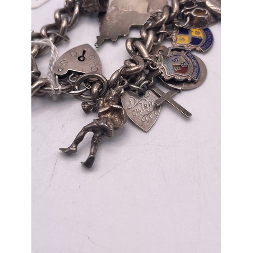 585u - Heavy silver charm bracelet 77.2g