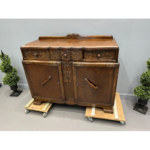 704 - Carved oak dining room suite inc drawer leaf table + 4 chairs + sideboard