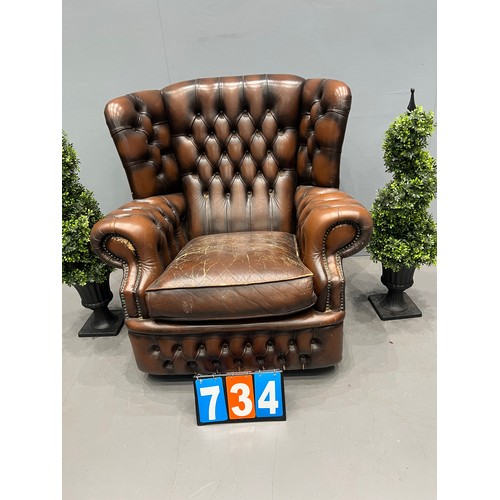 734 - Leather chesterfield wing back chair