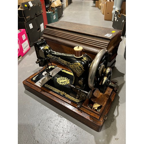 144 - Vintage sewing machine in case