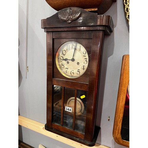 344 - Oak cased wall clock