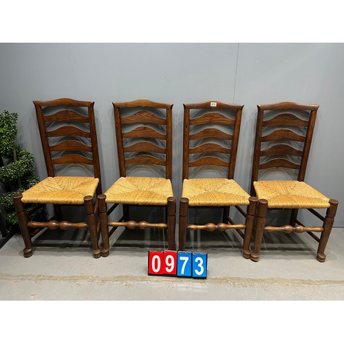 973 - 4 Oak ladder back chairs