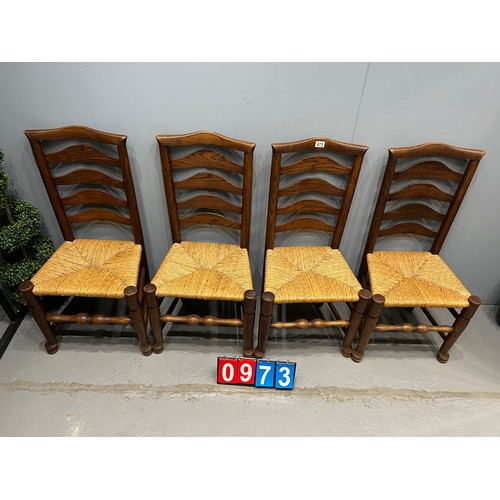 973 - 4 Oak ladder back chairs