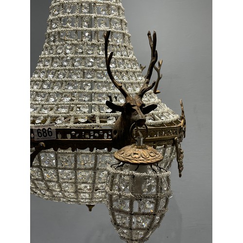 686 - Large chandelier with 3 stags heads holding smaller lights