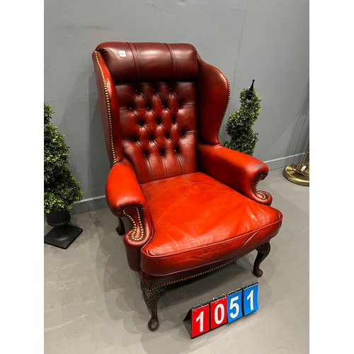 1051 - Red leather chesterfield wing back chair on cabriol leg good shape