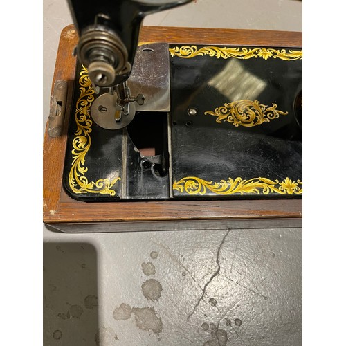 106 - Singer sewing machine in case