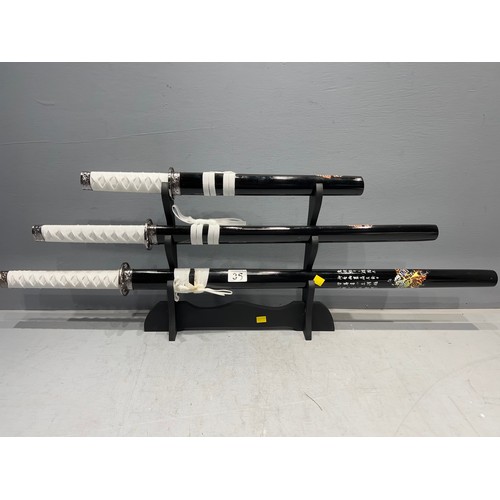 35 - Set 3 samurai swords on stand