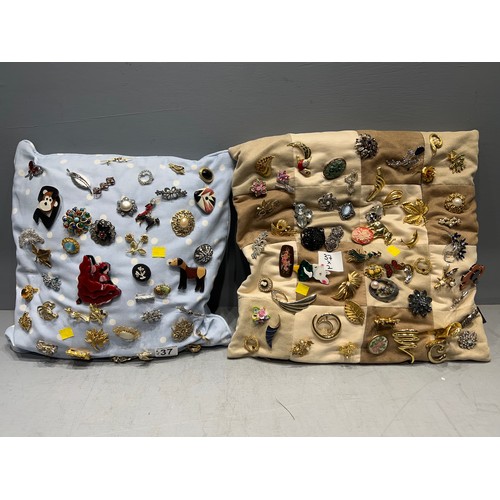 37 - 2 Cushions filled with brooches