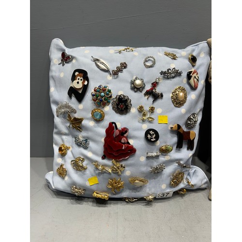 37 - 2 Cushions filled with brooches