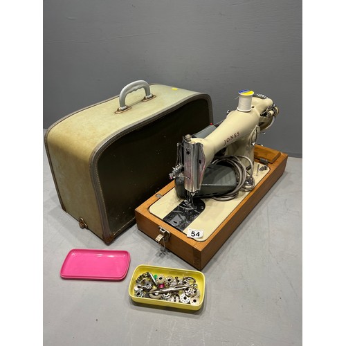 54 - Cased Jones electric sewing machine with accessories