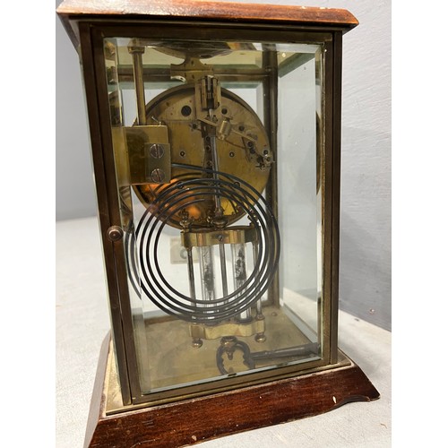 75 - Brass faced mantle clock in glass case