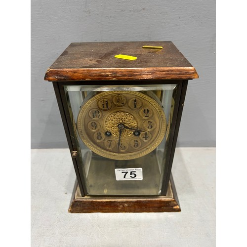 75 - Brass faced mantle clock in glass case