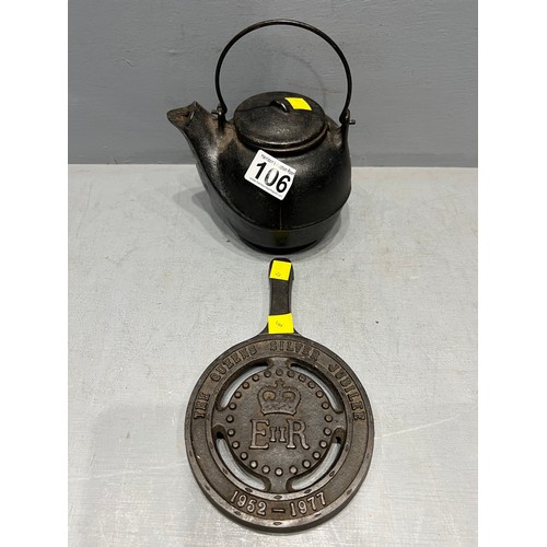 106 - E.r cast iron tea pot & stand