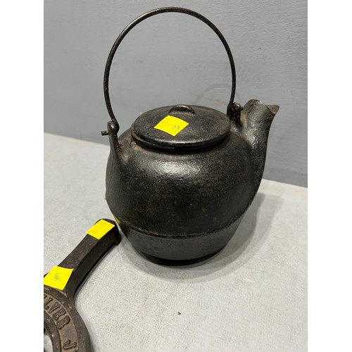 106 - E.r cast iron tea pot & stand