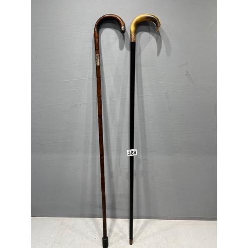 368 - 1 Gold & 1 silver rimmed walking sticks