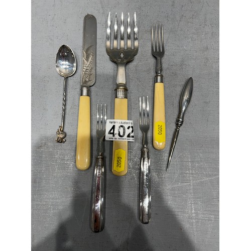 402 - 7 Pieces silver forks etc