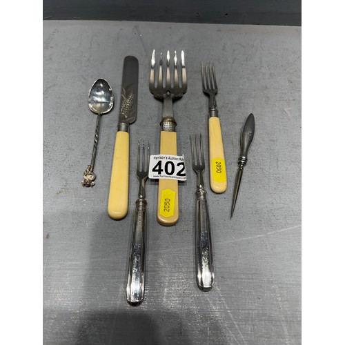 402 - 7 Pieces silver forks etc