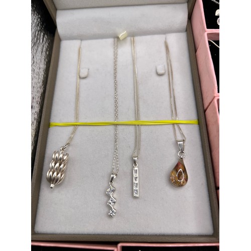 309 - Box silver 925 x 3x earrings, 3x brooches, 14x pendants, 1 bracelet, all boxed & chain