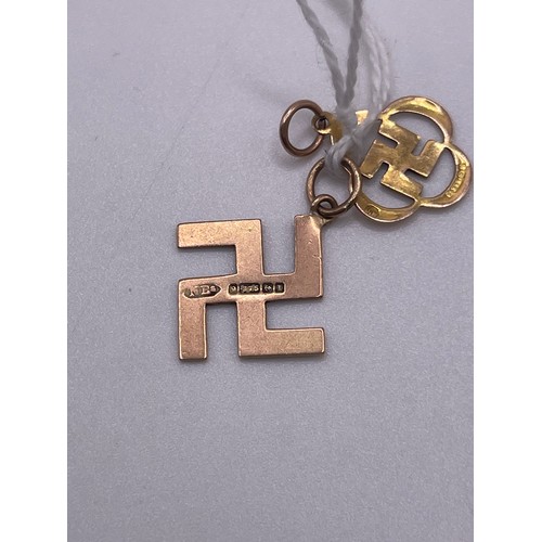 472 - 2x 9ct Gold German swastika pendants 1.7g