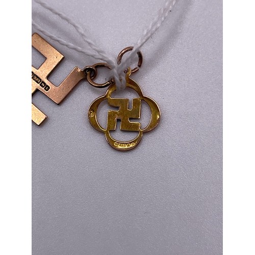 472 - 2x 9ct Gold German swastika pendants 1.7g