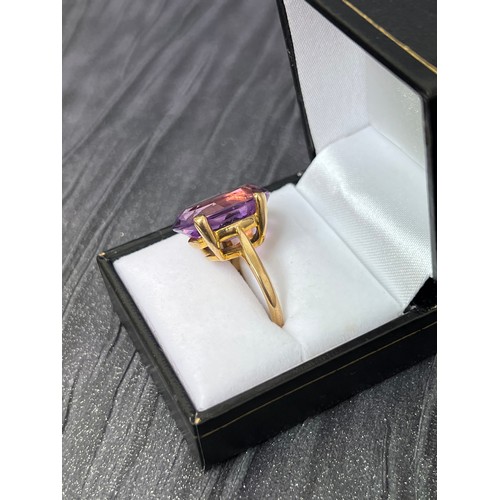 468 - 9ct Gold dress ring with large purple stone size M/N 6.8g gross