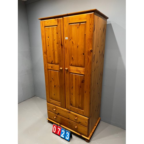 723 - Pine wardrobe over 2 drawers