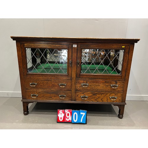 907 - Oak mirrored back sideboard/display cabinet with leaded glass doors with drawers