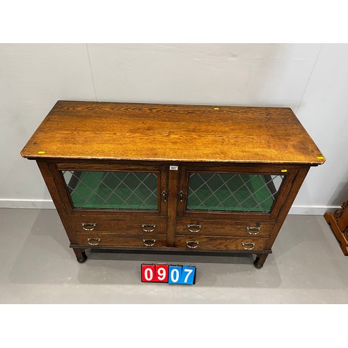 907 - Oak mirrored back sideboard/display cabinet with leaded glass doors with drawers